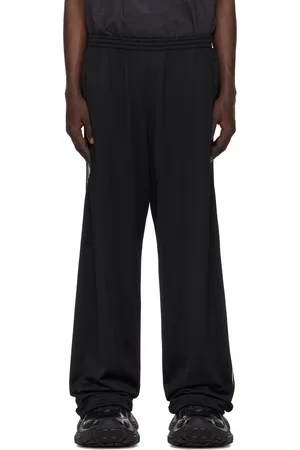 Balenciaga Pantalon de survêtement ample noir à rayures en filet