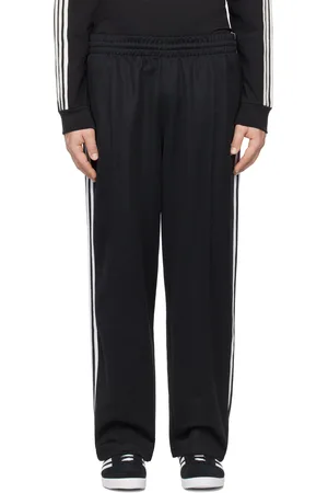 adidas Pantalon de survêtement ample Firebird noir - Adicolor