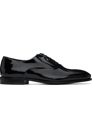 Salvatore Ferragamo Chaussures oxford noires à ornement ondulé