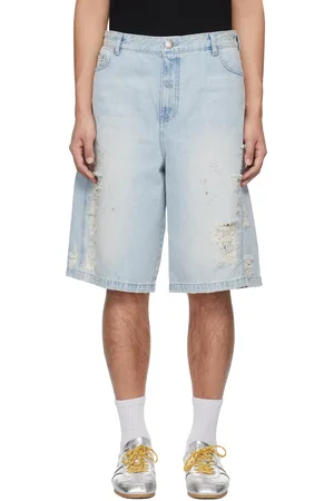 lesugiatelier Short bleu en denim à déchirures et à ornements facettés