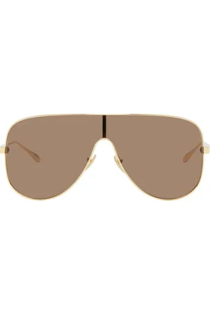 Gucci Lunettes de soleil de type visière dorées