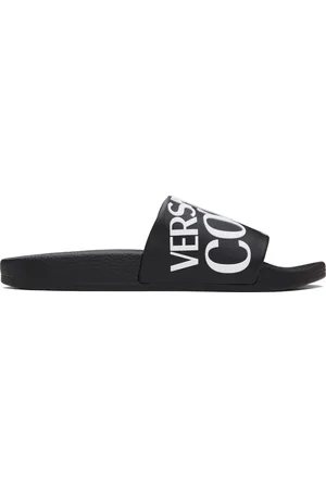 VERSACE Sandales à enfiler noires à logos
