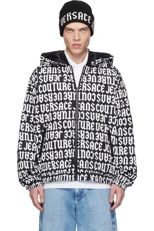 VERSACE Blouson réversible noir et blanc rembourré en duvet à motif à logos