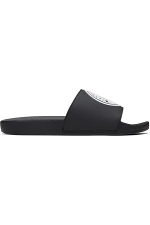 VERSACE Sandales à enfiler noires à logo circulaire