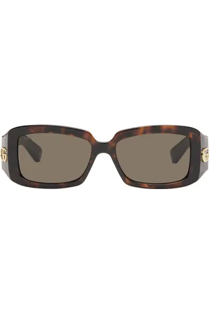 Gucci Lunettes de soleil brunes à ferrures à logo GG