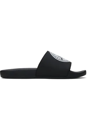 VERSACE Sandales à enfiler noires à logo contrecollé