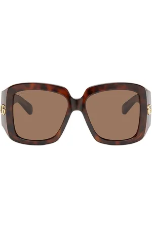 Gucci Lunettes de soleil brunes à ferrures à logo GG