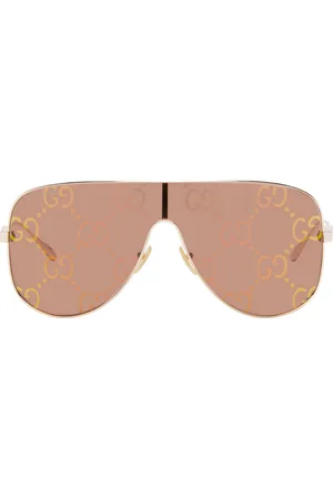 Gucci Lunettes de soleil de type visière doré rose