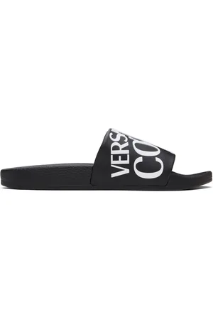 VERSACE Sandales à enfiler noires à logos