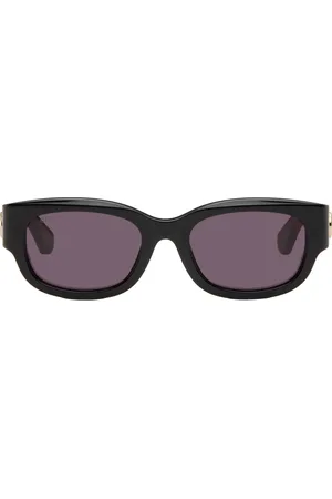 Gucci Lunettes de soleil ovales noir et rouge