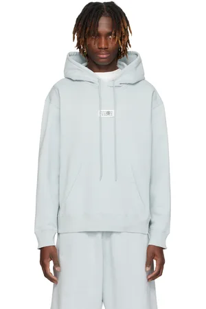Maison Margiela Pull à capuche bleu en coton non brossé