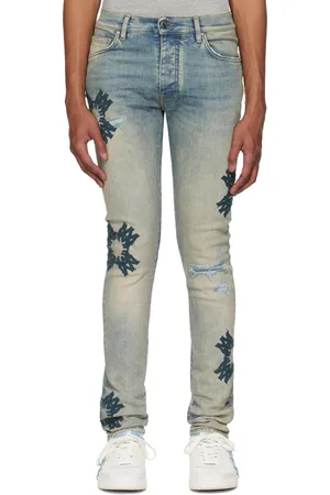 AMIRI Jean skinny bleu à appliqués à quadrigramme