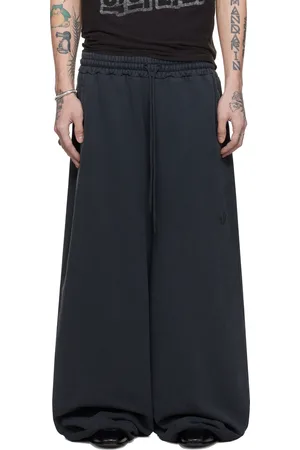 LU’U DAN Pantalon de survêtement de style bontan noir à bords bruts