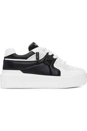 VALENTINO GARAVANI Baskets basses blanc et noir à clou One Stud et à plateforme