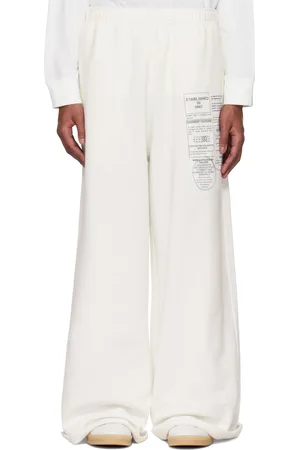 Maison Margiela Pantalon de survêtement blanc à imprimé de journal