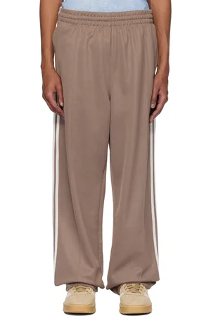 adidas Pantalon de survêtement ample Firebird brun - Adicolor