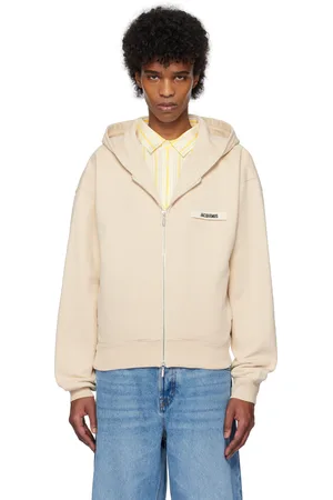 Jacquemus Pull à capuche beige à glissière et à écusson en gros-grain - La casa