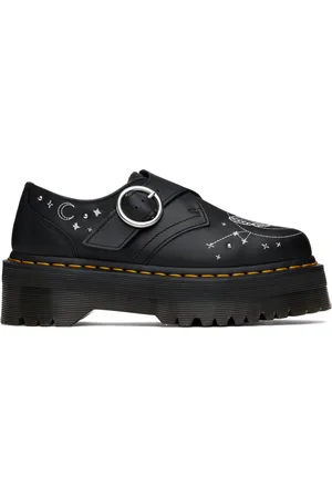 Dr. Martens Chaussures à boucle noires en cuir à plateforme et à images