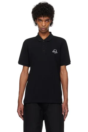 Moschino Polo noir à image de couronne de laurier à logo