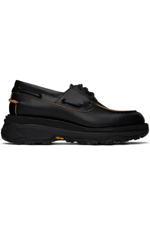 SACAI Chaussures bateau noires en cuir