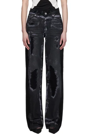 Jean Paul Gaultier Jean noir à ornements floqués