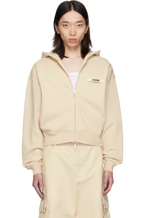 Jacquemus Pull à capuche beige à glissière et à écusson en gros-grain - La casa
