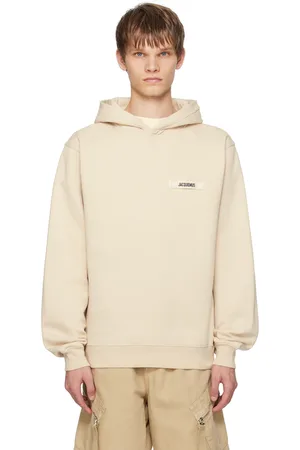 Jacquemus Pull à capuche beige à écusson en gros-grain - Les classiques