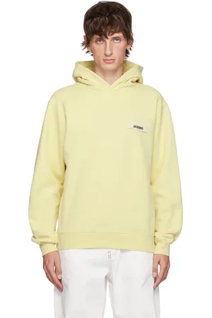 Jacquemus Pull à capuche jaune à écusson en gros-grain - La casa