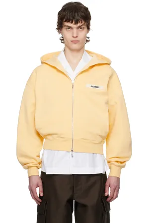 Jacquemus Pull à capuche jaune à glissière et à écusson en gros-grain - La casa
