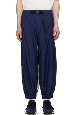 Y-3 Pantalon de survêtement bleu en nylon à rayures emblématiques