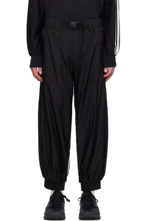 Y-3 Pantalon de survêtement noir en nylon à rayures emblématiques