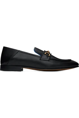 VERSACE Chaussures à enfiler noires à ferrure à logo Medusa 