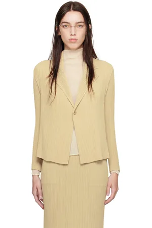 Issey Miyake Veston beige à plissures Hatching