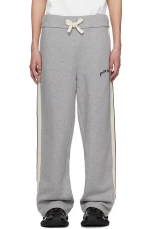 Palm Angels Pantalon de survêtement gris à logo incurvé