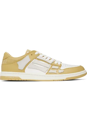 AMIRI Baskets basses jaunes à appliqués Skel Top et à quadrigrammes dégaufrés