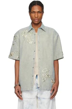 DRIES VAN NOTEN Chemise bleue à ferrures graphiques
