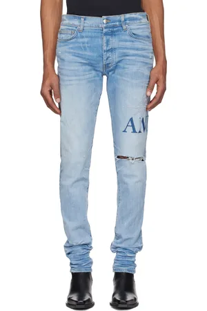 AMIRI Jean skinny bleu à appliqués à logo Starburst