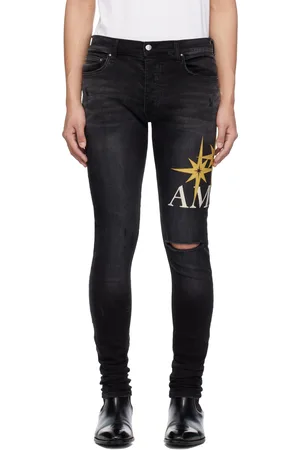 AMIRI Jean skinny noir à appliqués à logo Starburst