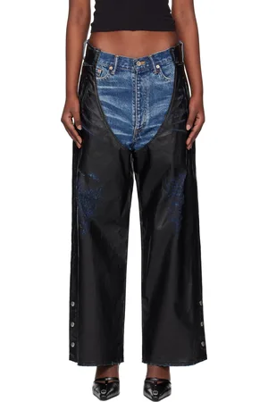 DOUBLET Jean bleu et noir à jambières en cuir synthétique et à enduit