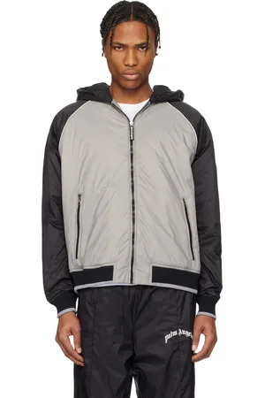 Palm Angels Blouson coupe-vent noir et gris à logo incurvé