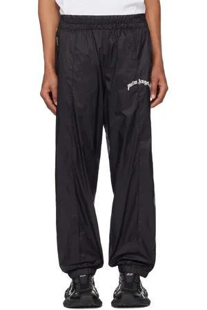 Palm Angels Pantalon de survêtement noir en nylon à logo incurvé