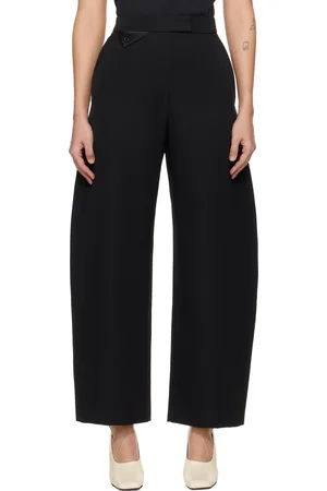 Recto Pantalon noir en laine à taille haute et à jambes incurvées