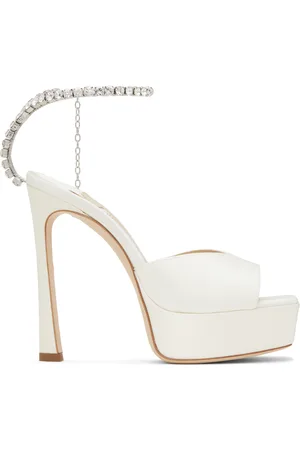 Jimmy Choo Sandales à talon 125 blanc cassé à chaine Saeda exclusives à SSENSE