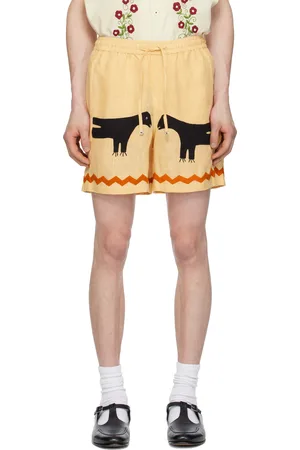 HARAGO Short jaune à appliqués de corneille