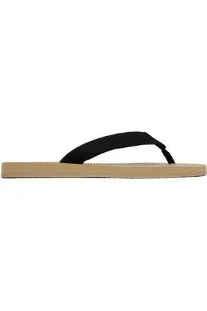 The Row Tongs Dune beige et noir