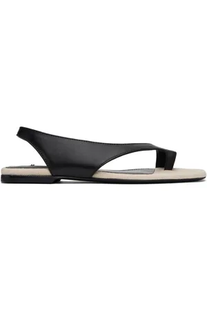 Totême Sandales noires en cuir à bride de style tong