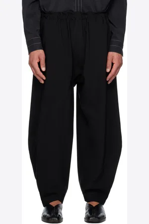 Issey Miyake Pantalon noir à assemblage portefeuille