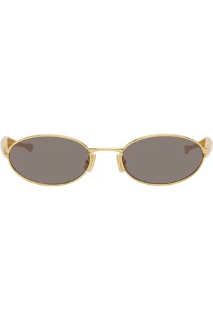 Bottega Veneta Lunettes de soleil ovales dorées à branches Sardine exclusives à SSENSE