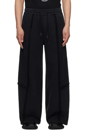 Feng Chen Wang Pantalon de survêtement noir à effet usé