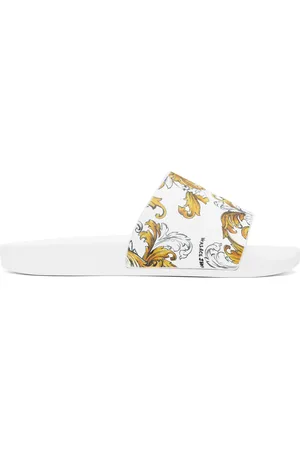 VERSACE Sandales à enfiler blanches à motif Barocco